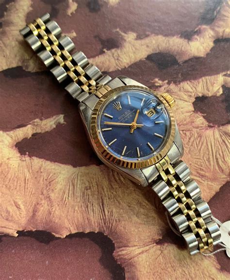 silver rolex with blue dial|Rolex watch with blue face.